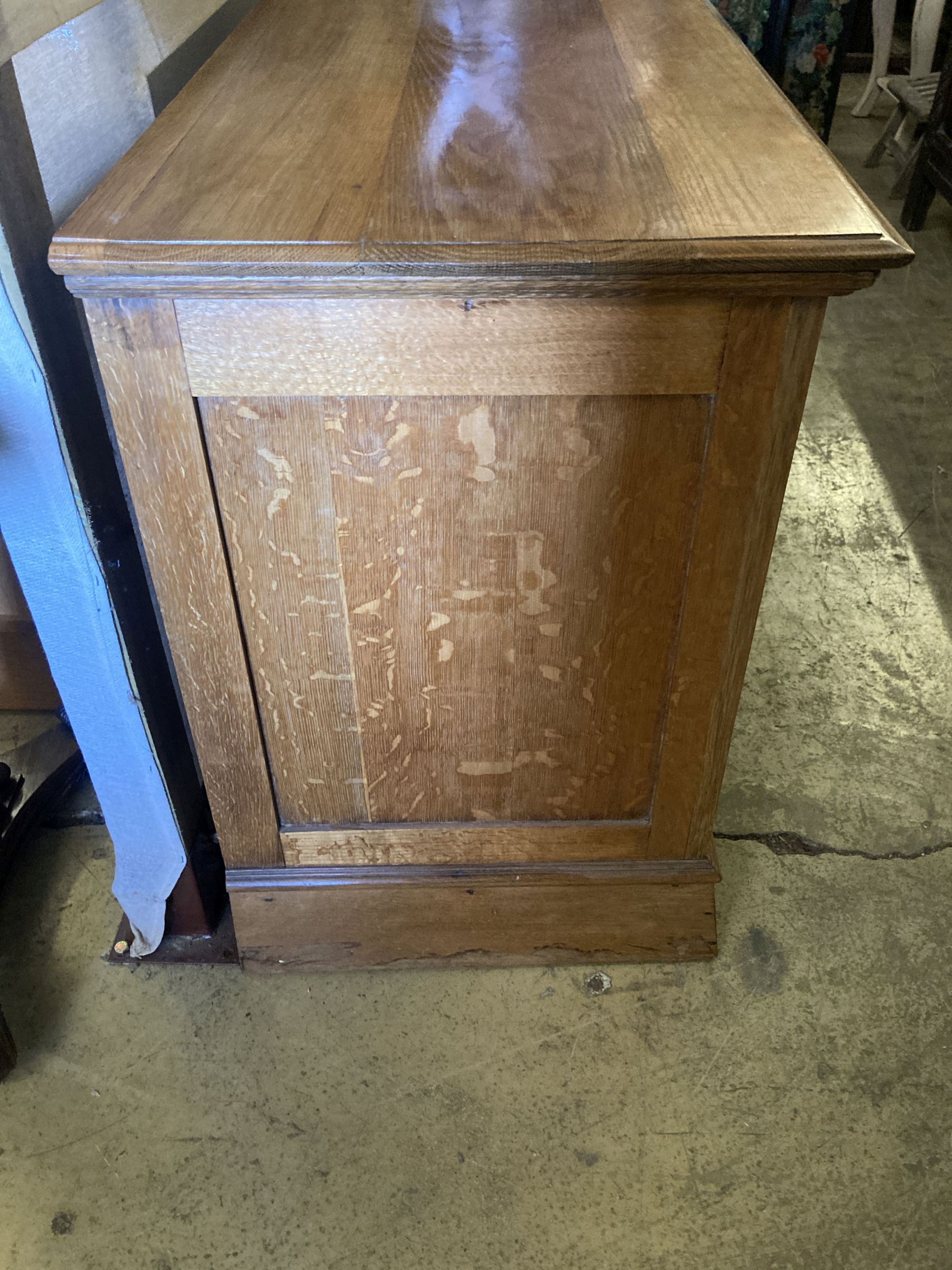 A late Victorian oak chest of three drawers, width 106cm, depth 55cm, height 81cm